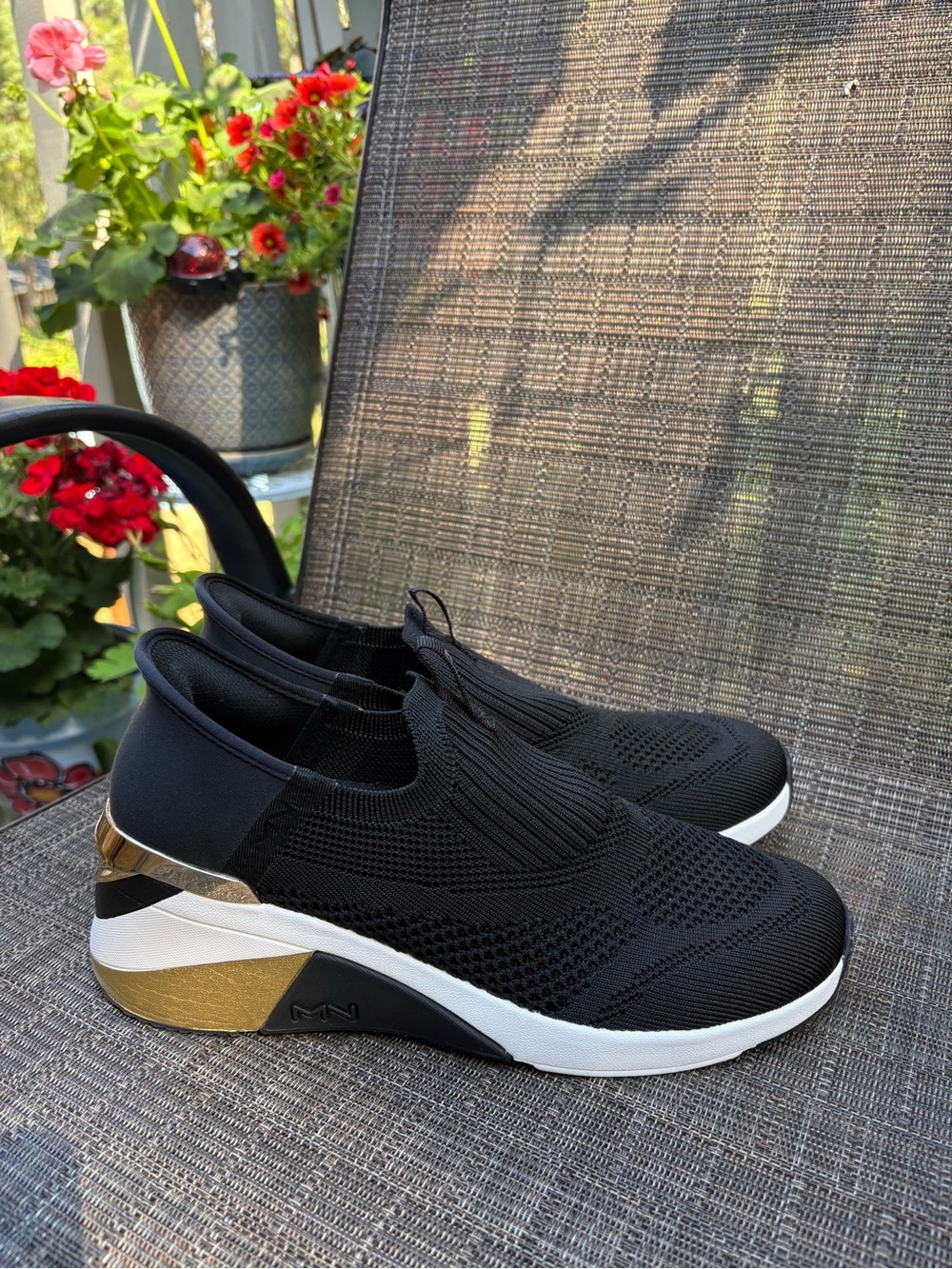 Skechers Black Slip-On Knit Sneakers with Gold Accents